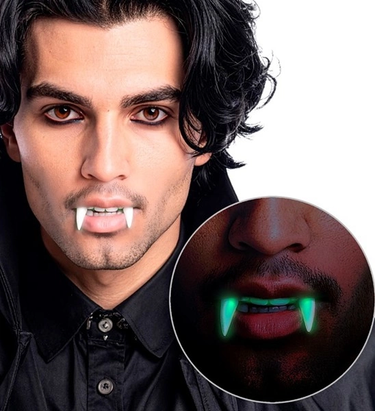 denti da vampiro fluorescenti